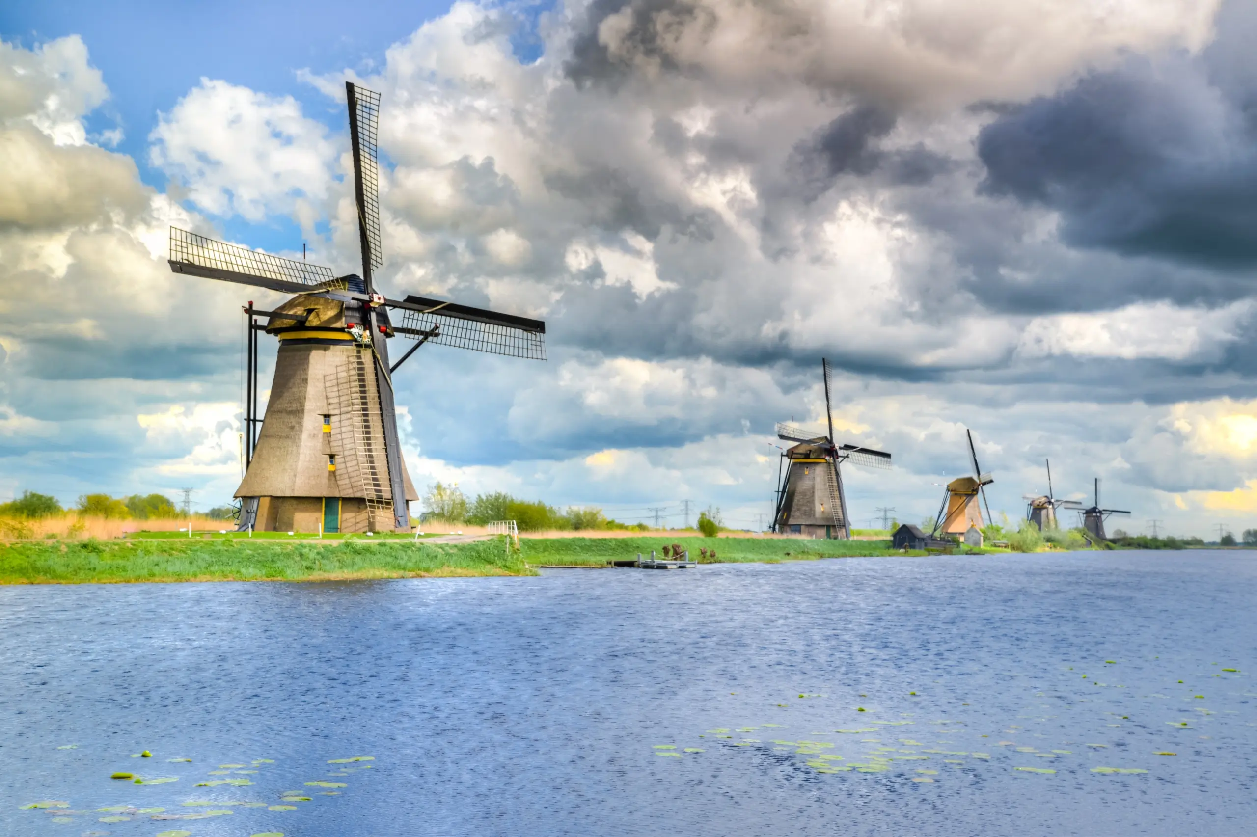 windmills next to water