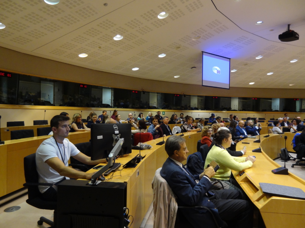 participants in a large auditorium in the European Parliament 