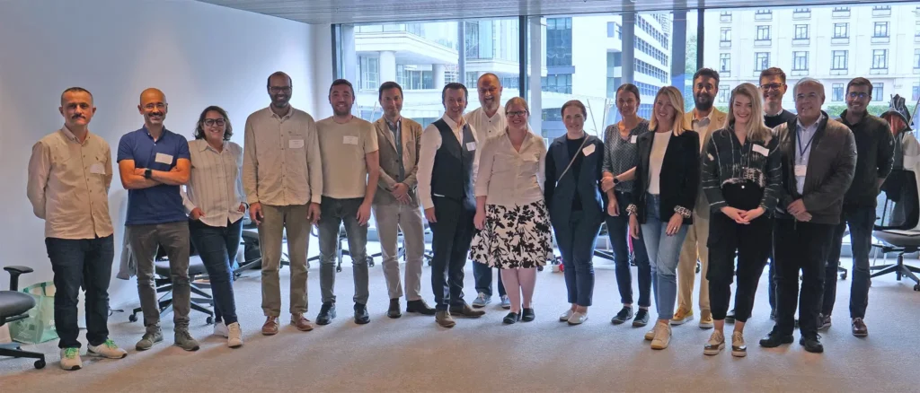 group photo of the event participants in the meeting room